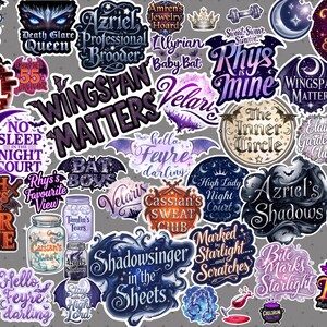 May include: A collection of fantasy-themed stickers with various designs and text. The stickers feature phrases like "Rhys is Mine," "Wingspan Matters," and "Shadowsinger in the Sheets." Colors include purple, black, and white.