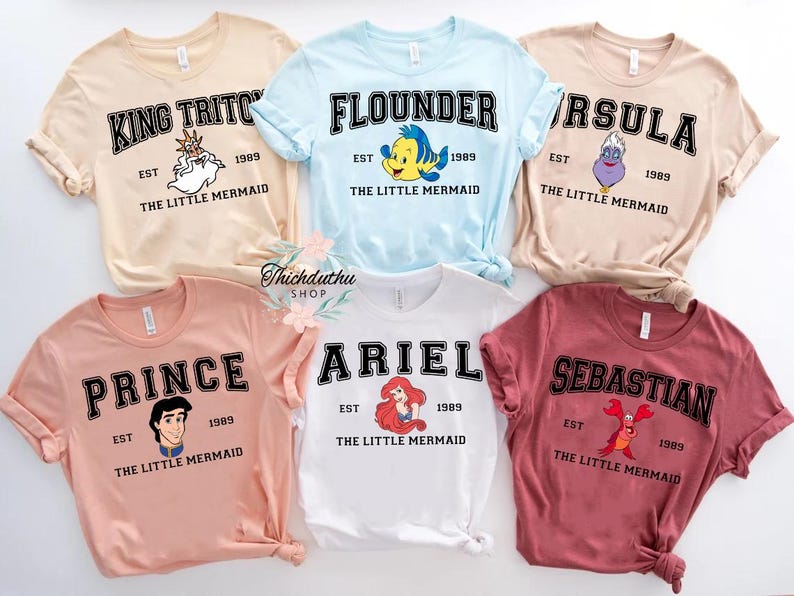 a bunch of shirts that are on a table