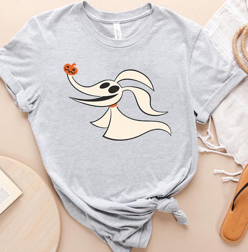 a t - shirt with an image of a ghost with a lady bug on it