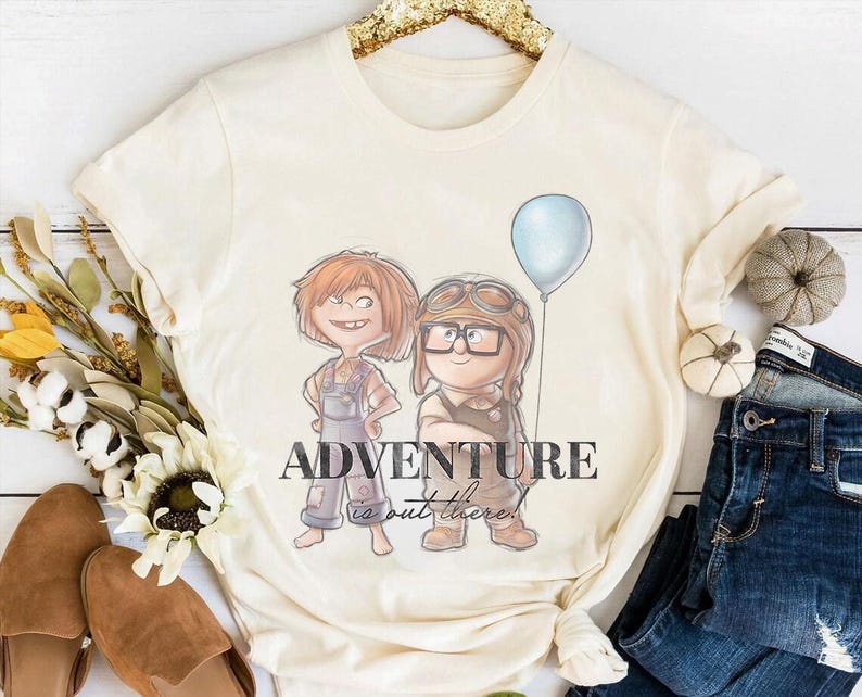 a t - shirt with a picture of two people holding a balloon