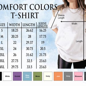 a woman wearing a white t - shirt and black leggings