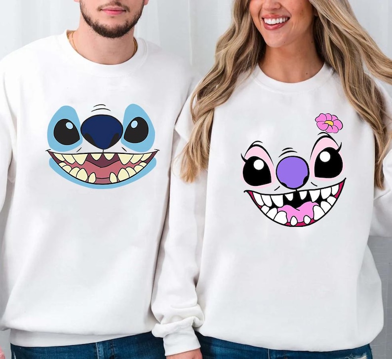 a man and a woman wearing matching sweatshirts