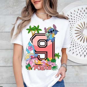 a woman wearing a t - shirt with the letter p on it