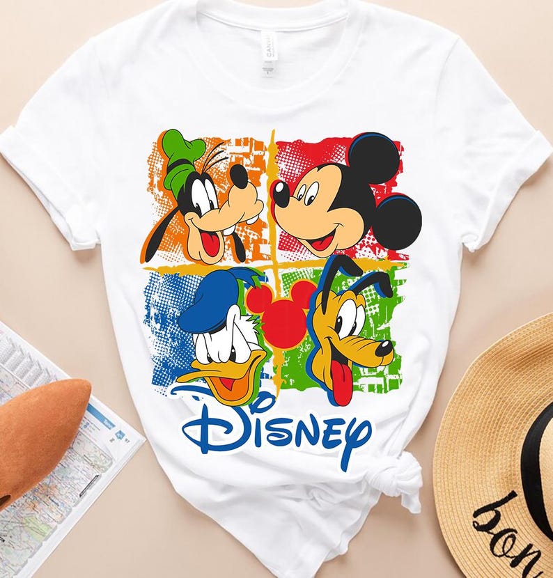 a mickey mouse and mickey mouse t - shirt on a table