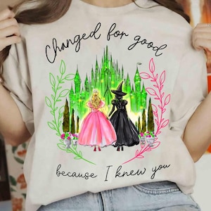 a woman wearing a t - shirt that says, changed for good because i knew