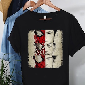 a spider - man and spider - man t - shirt hanging on a clothes rack
