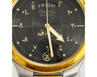 Seiko Trident 7N43-6030 2-tone day date quartz men's watch in Arabic, working