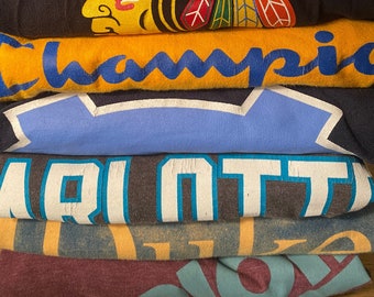 3 Pack of Mystery Tees, each blind bag contains 3 vintage thrifted surprise graphic 90's Y2k pop culture tees.  Bands, sports teams, ncaa