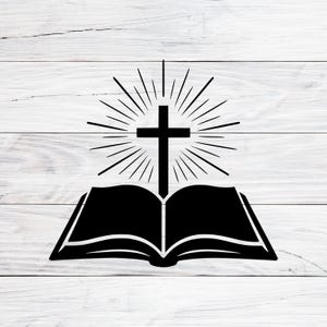 May include: A black graphic of an open book with a cross above it, radiating light. The design is set against a white wood-grain background. The cross is centered above the open book.