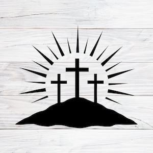 May include: A black silhouette of three crosses atop a hill, with radiating lines suggesting a sunrise or halo effect. The image is set against a white, wood-grain background.