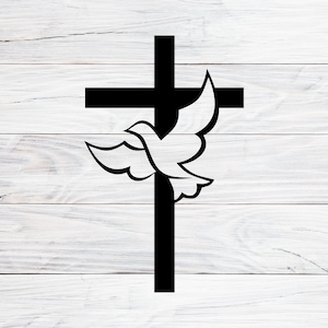 May include: A black silhouette of a dove flying over a black cross. The dove is positioned in front of the cross, with its wings spread out. The background is a white wooden surface.