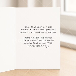 May include: A white greeting card with German text. The text reads: "Your text can be printed on the inside of the card - it will look like this. Simply select the option 'With inner text' and write your text in the 'Personalization' field."