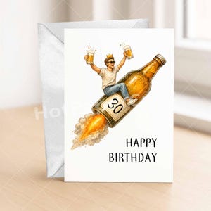 May include: A birthday card with a white envelope. The card features a cartoon illustration of a person riding a beer bottle rocket, holding two mugs of beer, and wearing a crown. The number "30" is on the bottle, and the words "HAPPY BIRTHDAY" are below.
