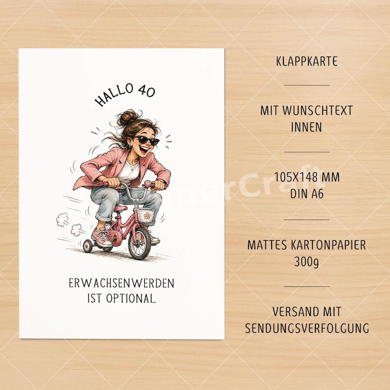 May include: A white greeting card with a cartoon illustration of a woman riding a pink tricycle. The card has the text "Hallo 40" and "Erwachsenwerden ist optional". The card measures 4.1 x 5.8 inches.