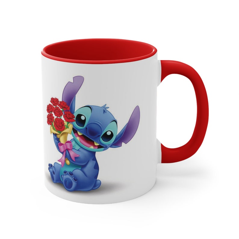 May include: A white ceramic mug with a red rim and handle. The mug features a cartoon image of Stitch from Lilo & Stitch holding a bouquet of red flowers.