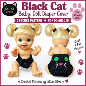 May include: A crochet pattern PDF download for a black cat baby doll diaper cover. The image shows a doll with blonde pigtails wearing the black diaper cover, which features green button eyes, a pink heart nose, and white whiskers on the back.