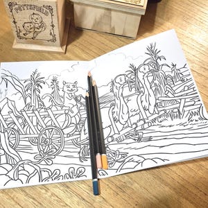 May include: A black and white coloring page featuring a cat pulling a wagon full of pumpkins and two birds perched on a fence.
