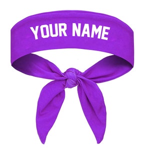 May include: Purple headband with a white knot and the text "YOUR NAME" printed on the headband.