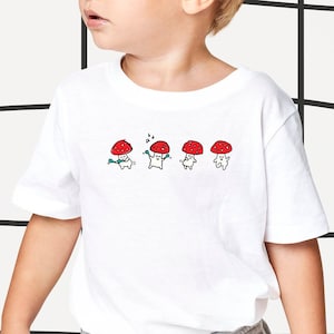 Whimsical Dancing Mushroom Jersey Tee for Toddlers | Cottagecore Woodland Book Lover Gift