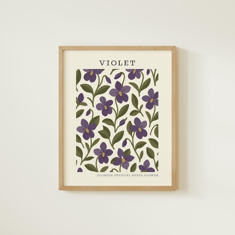 The image is a framed print featuring a repeating pattern of purple flowers with green leaves.