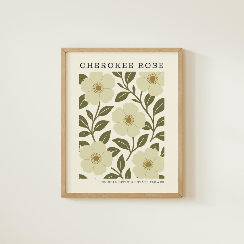 The image is a framed print featuring a repeating pattern of white flowers with green leaves, with the text "CHEROKEE ROSE" and "GEORGIA OFFICIAL STATE FLOWER" printed on it.