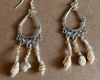 Dangle earrings made with seashells and dead beads