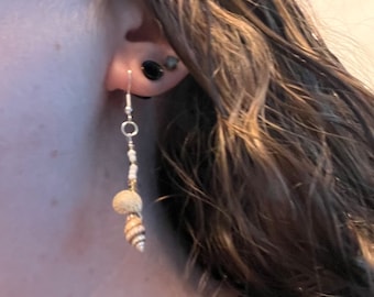 Dangle earrings made with seashells and seed beads