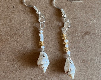 Dangle earrings made with seashells and seed beads