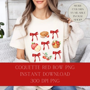 May include: A white t-shirt with a design of red bows and watercolor illustrations of apples, apple pie, and a basket of apples. The text "COQUETTE RED BOW PNG INSTANT DOWNLOAD 300 DPI PNG" is at the bottom of the image.