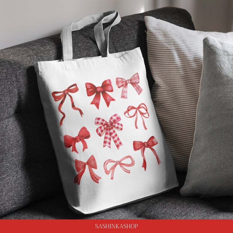 May include: A white canvas tote bag with a red and white bow design. The bag has a grey handle and the text "SASHINKASHOP" is printed on the bottom.
