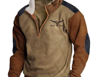 May include: A brown and tan pullover with a mock neck and a quarter-zip closure. The long-sleeved shirt features a black bull skull graphic with the words "WILD WEST". The shirt has a fleece-lined collar and elbow patches.