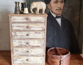 Antique French haberdashery or watchmaker&#39;s furniture, flea market workshop