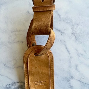 Louis Vuitton luggage tag black Leather ref.622307 - Joli Closet