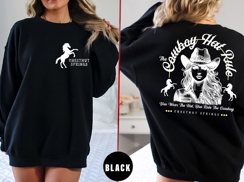 May include: Black sweatshirt with a white horse and the text "Chestnut Springs" on the front and a white graphic of a woman wearing a cowboy hat with the text "The Cowboy Hat Rule" and "You Wear The Hat, You Ride The Cowboy" and "Chestnut Springs" on the back.