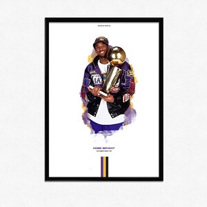 May include: A framed print featuring Kobe Bryant holding a trophy. He wears a purple and black jacket with gold accents. The print includes the text "Kobe Bryant Los Angeles Lakers / #8".