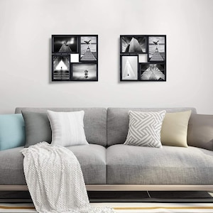 May include: Two black picture frames with a collage of six black and white photos. The frames are hanging on a white wall above a gray couch with pillows.