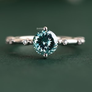 Cyan Moissanite Engagement Ring: Portuguese Cut, Sterling Silver