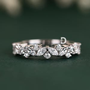 This multi-stone diamond ring is the perfect blend of elegance and modern sophistication. Featuring dazzling diamonds set in a beautifully crafted band, this ring exudes brilliance from every angle. Whether worn as a wedding band, stacking ring, or promise ring, it is designed to add timeless beauty to any jewelry collection.