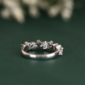 This diamond wedding band is a timeless choice for brides looking for elegance and sophistication. Its delicate design and shimmering diamonds make it the perfect complement to any engagement ring. Whether used as a wedding band or anniversary ring, it symbolizes everlasting love and commitment