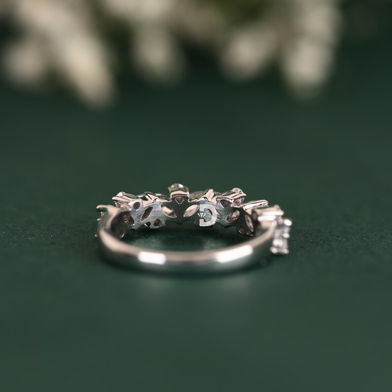 This diamond wedding band is a timeless choice for brides looking for elegance and sophistication. Its delicate design and shimmering diamonds make it the perfect complement to any engagement ring. Whether used as a wedding band or anniversary ring, it symbolizes everlasting love and commitment