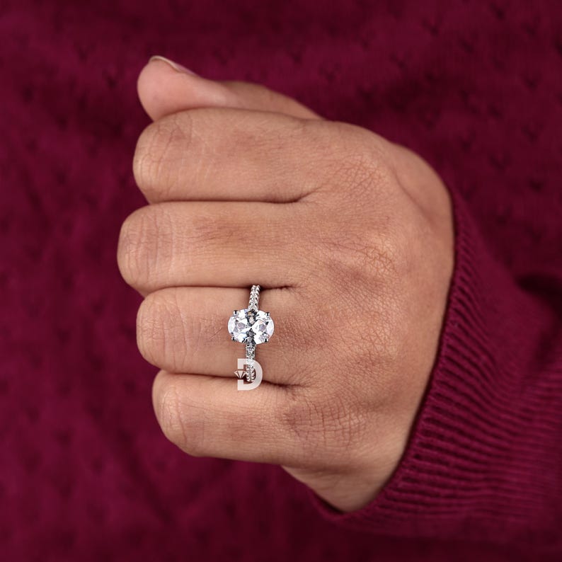 This 14K gold engagement ring is meticulously handcrafted to perfection, offering both beauty and durability. Available in yellow gold, white gold, and rose gold, you can choose the metal that best complements your personal style. The luxurious gold band provides a warm and timeless appeal, enhancing the overall charm of the Art Deco design.