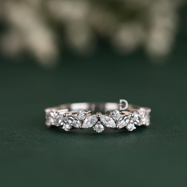 This multi-stone diamond ring is the perfect blend of elegance and modern sophistication. Featuring dazzling diamonds set in a beautifully crafted band, this ring exudes brilliance from every angle. Whether worn as a wedding band, stacking ring, or promise ring, it is designed to add timeless beauty to any jewelry collection.