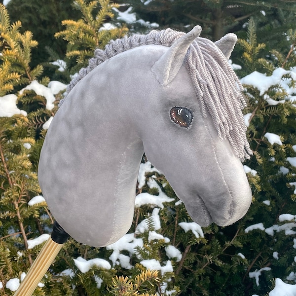 dapple grey hobby horse with a stick steckenpferd