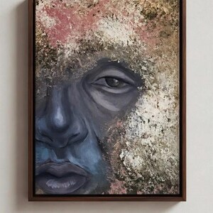 May include: A framed oil painting featuring a close-up portrait of a face rendered in shades of dark blue and purple. The surrounding area is composed of thick, textured impasto paint strokes in earthy tones of beige, brown, and muted pink.