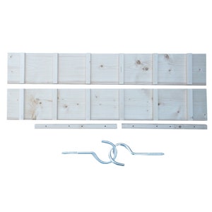 May include: A set of wooden shelves with a natural finish. The shelves are made of two long pieces of wood with a series of vertical dividers. The set also includes two metal hooks and two metal rods.