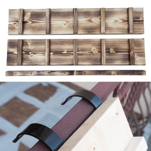 May include: Three wooden shelves with a burnt finish and metal brackets. The shelves are made of natural wood with a rustic look. The brackets are black metal and are attached to the wall.