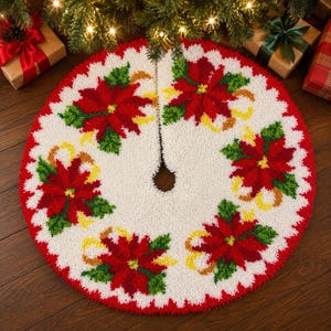 May include: A round, white, textured Christmas tree skirt featuring a repeating pattern of red poinsettia flowers with green leaves and yellow accents. The circular mat has a central opening and a straight slit for placement around a tree base.