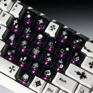 May include: A set of three ceramic mugs with a speckled, matte finish. The mugs are in shades of cream, light gray, and dark gray. Each mug has a simple, minimalist design, perfect for coffee or tea.