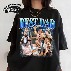 May include: Black t-shirt with a graphic print of a group of people and the text "Best Dad Ever" in blue and white.