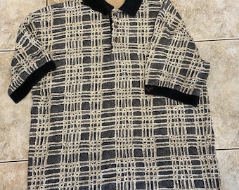Polo de golf vintage Greg Norman de los años 90, talla mediana.